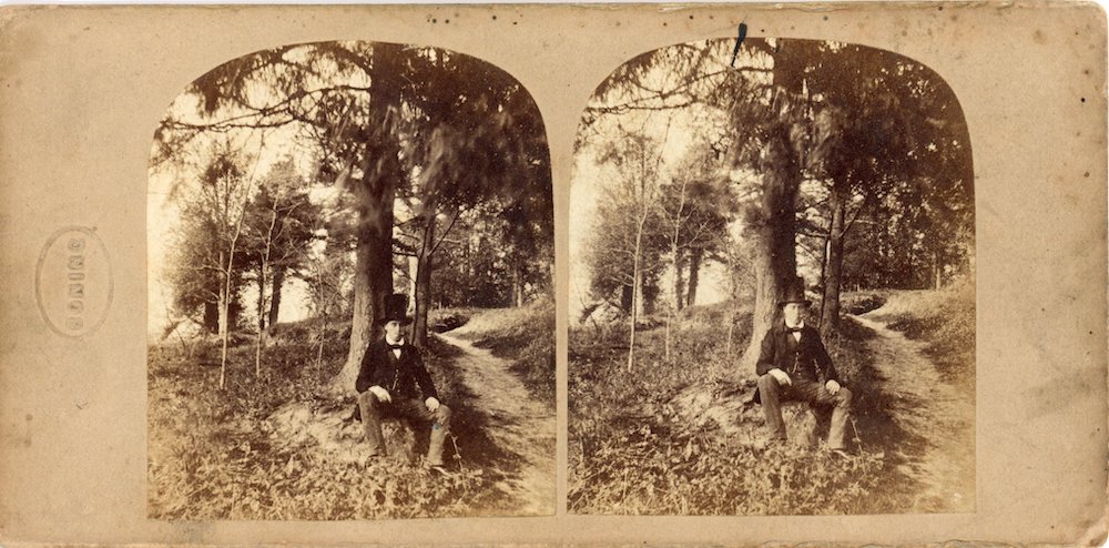 Image of a rectangular stereo photograph showing risqué image of partially dressed woman