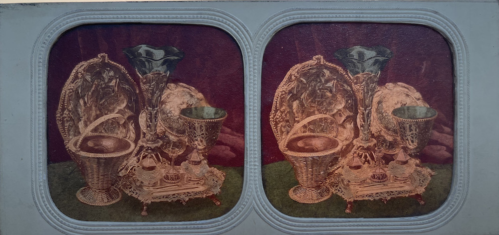 Image of a rectangular stereo photograph showing risqué image of partially dressed woman